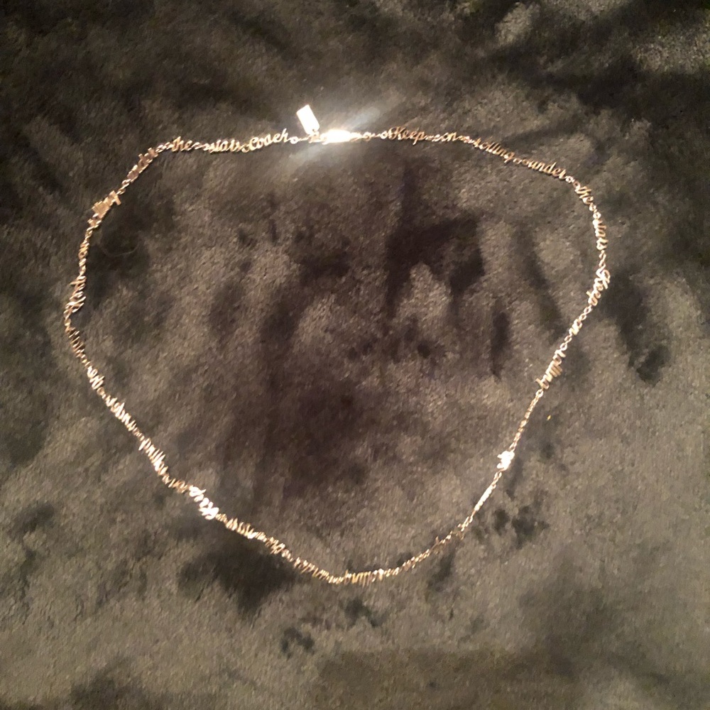 Coach “keep on rolling under the stars” necklace.